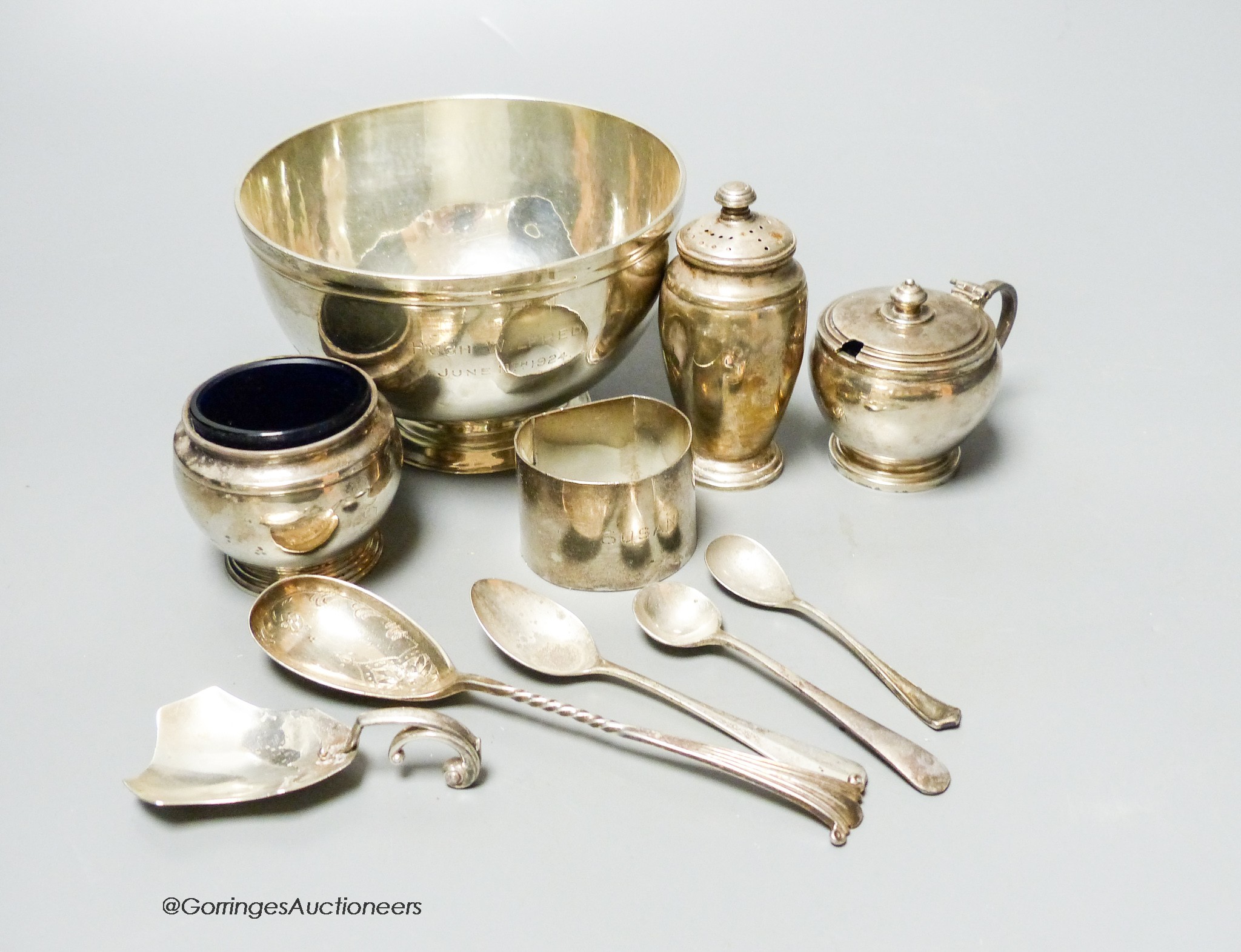 A small collection of English silver and plate to include a footed bowl, mustard pot and salt, napkin ring, caddy spoon, pepper pot etc. 17 oz.